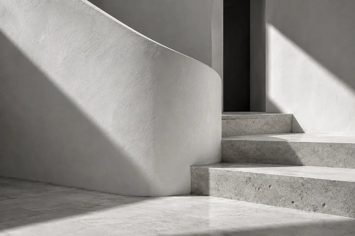 Sculptural white staircase and precise architectural shadows